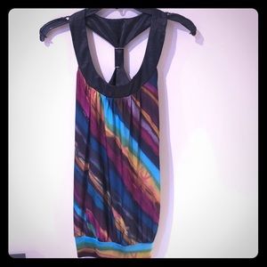 Low scoop neck sleeveless blouse. Multi colored